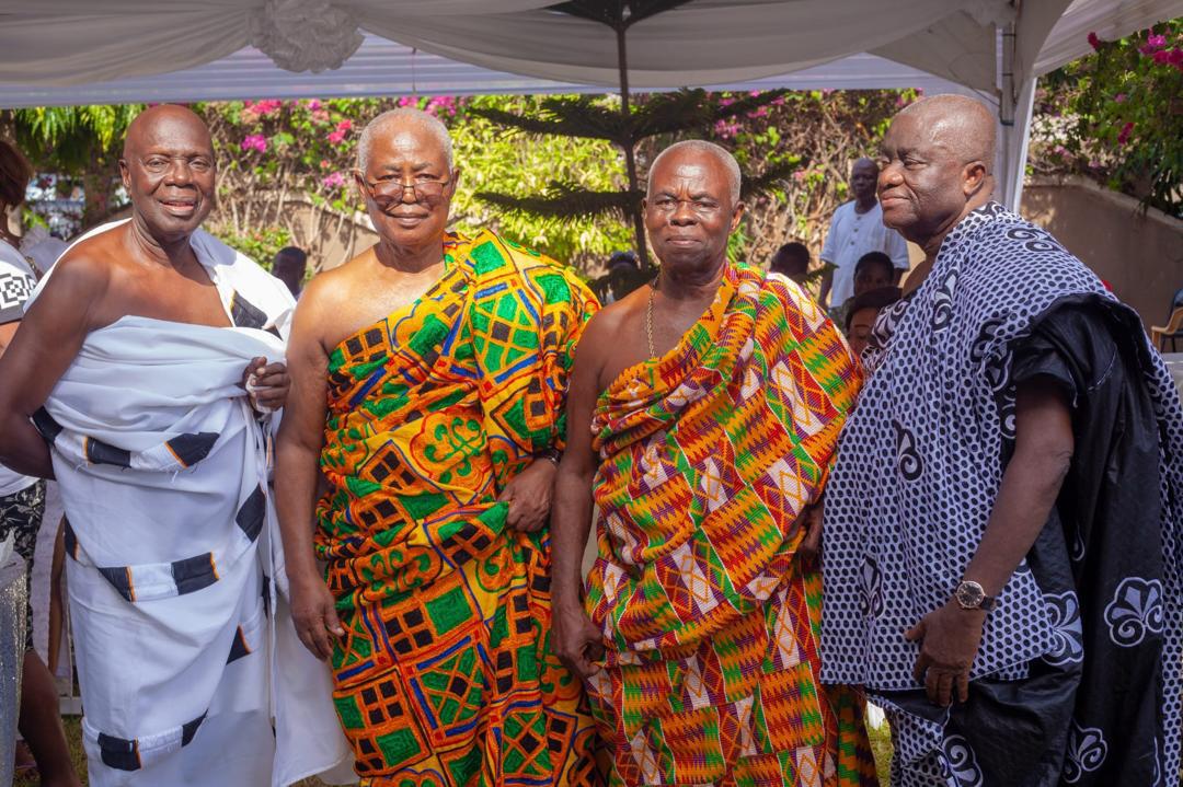 With fellow elders in Kente